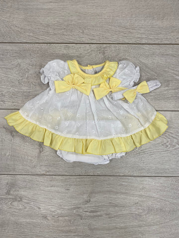 This gorgeous little white dress would make a stunning outfit this summer. Featuring a cute frilly lemon trim and matching lemon bows. This short and dress set also comes with a matching headband.