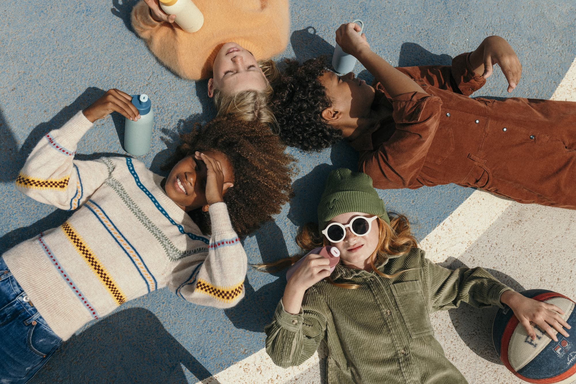 kids laying on the school yard 