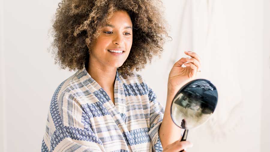 woman using plastic free hair products