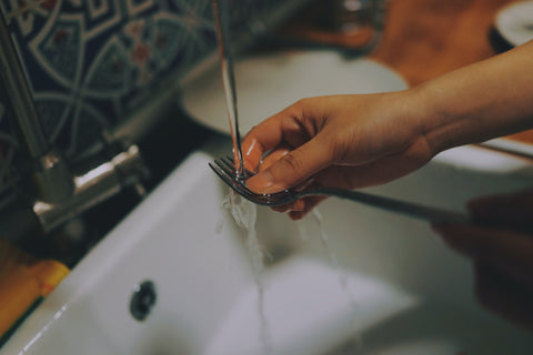 wash dishes by hand