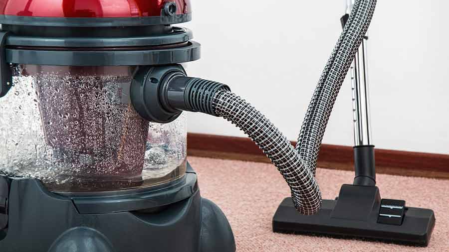 vacuuming car mats