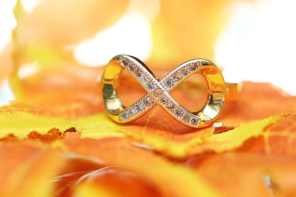 A beautiful infinite themed engagement ring close up view