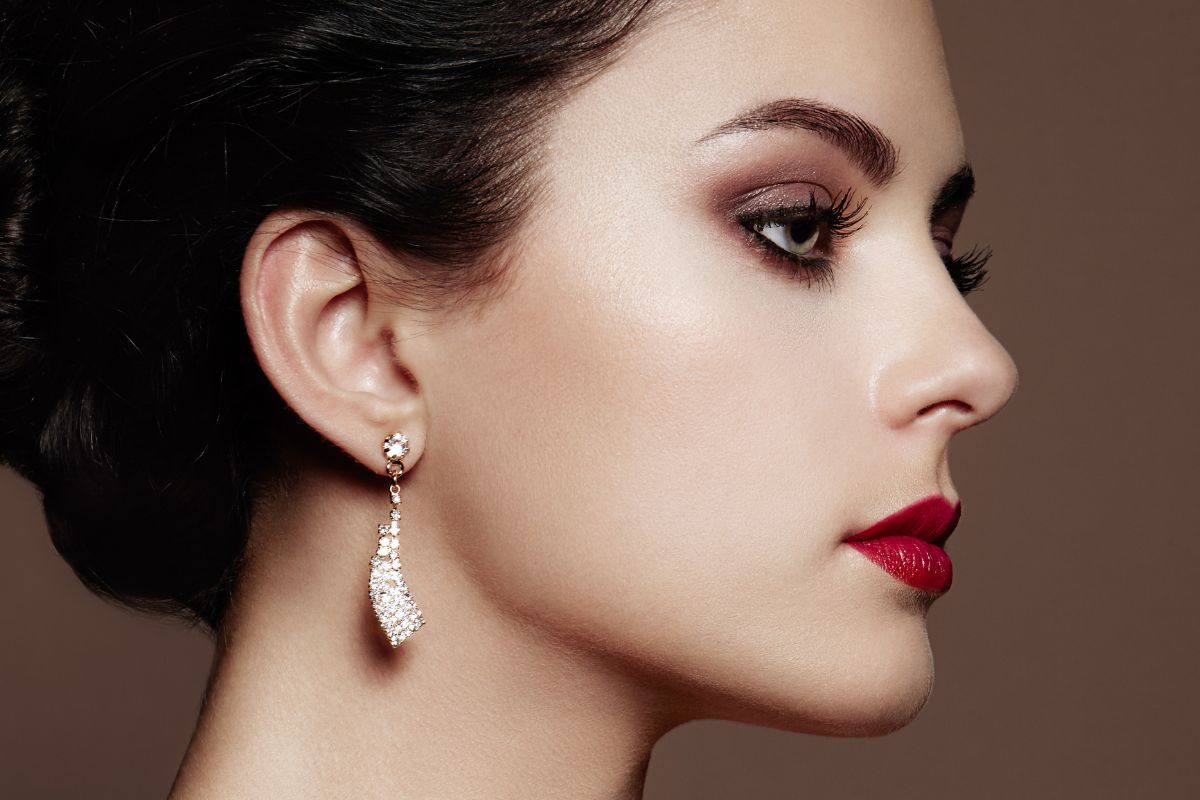 A beautiful woman wearing diamond earrings
