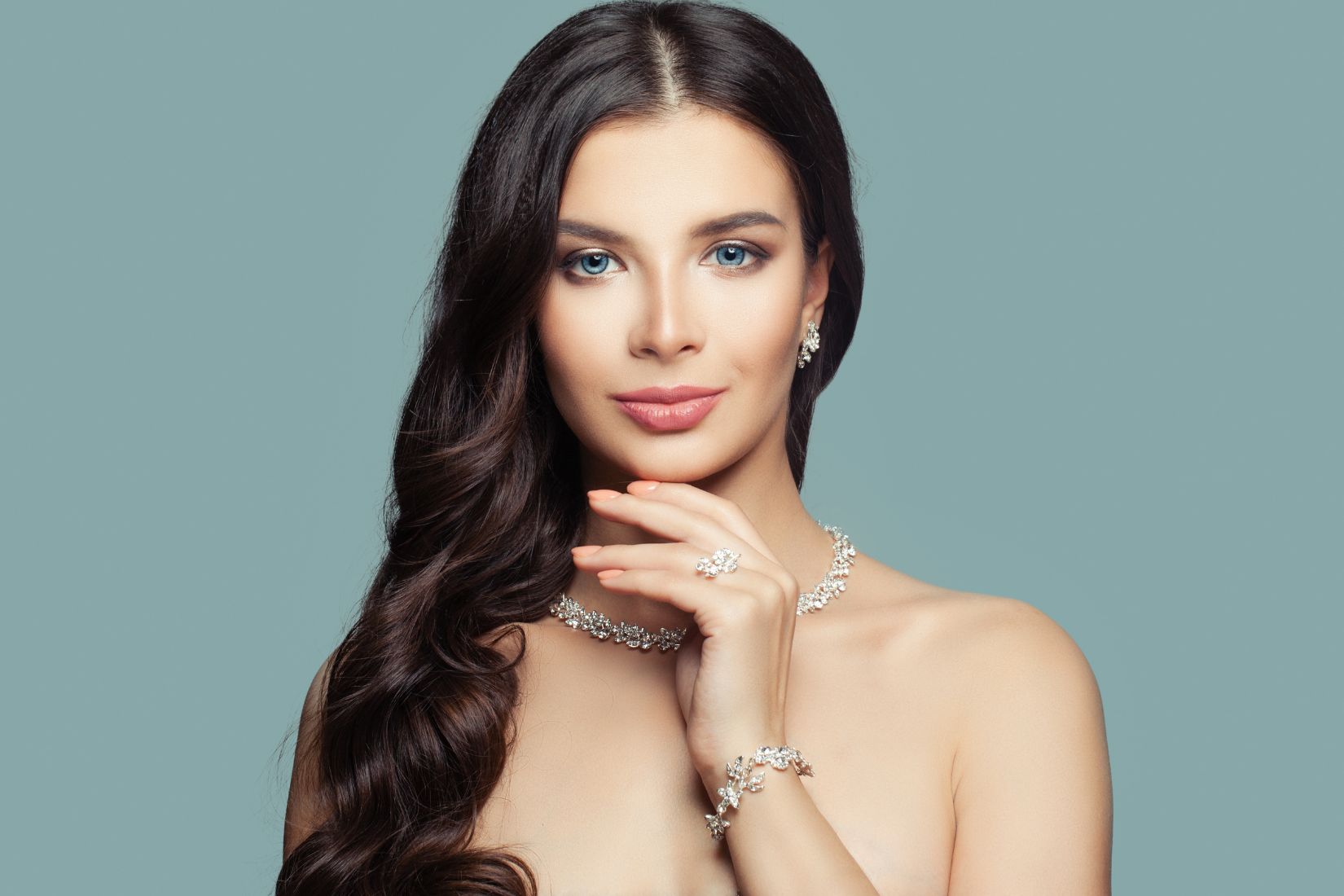 A beautiful woman wearing white gold jewelry