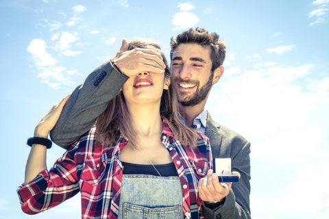 A boyfriend give his girlfriend a surprise ring