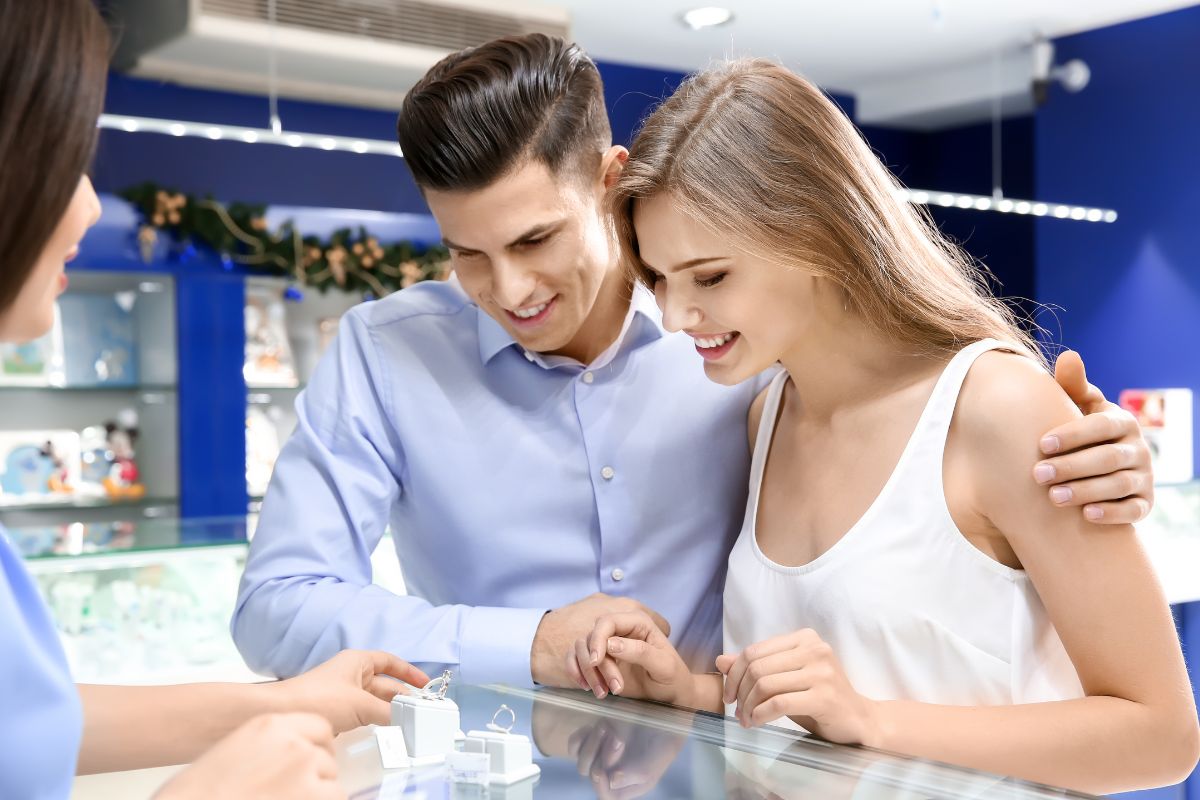 A couple purchasing diamond ring from jewelry shop