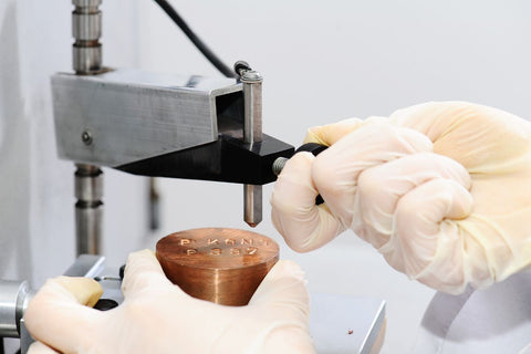 A guy hardness testing in a lab