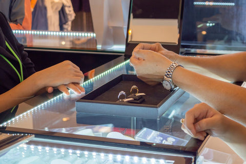 A lady shopping for a diamond engagement ring