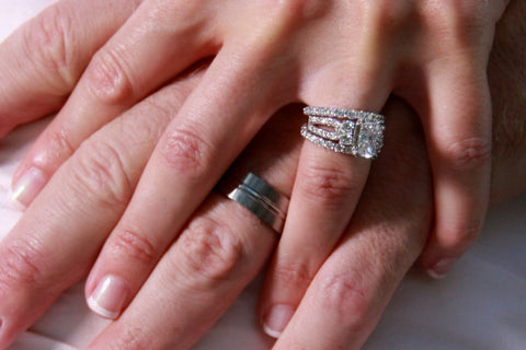 A husband and wife wearing an anniversary band