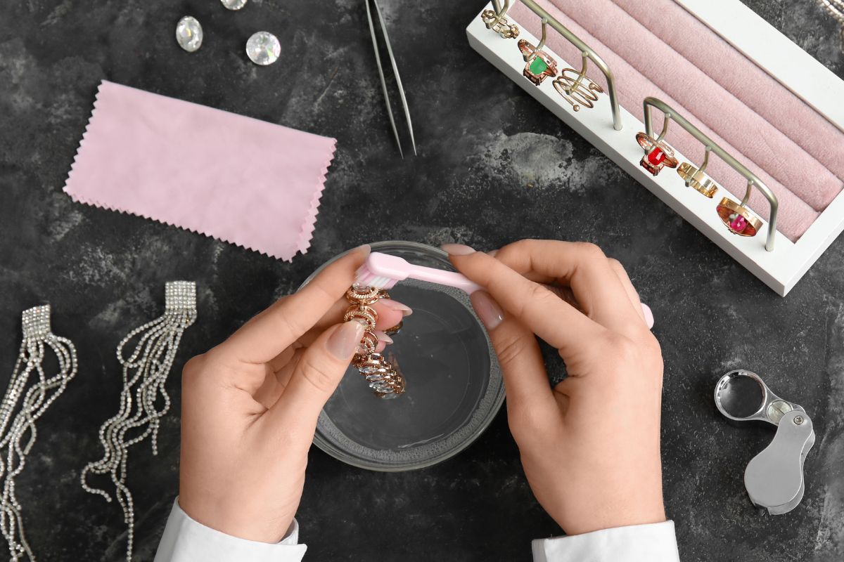 A lady cleaning her diamond rings and other jewelleries