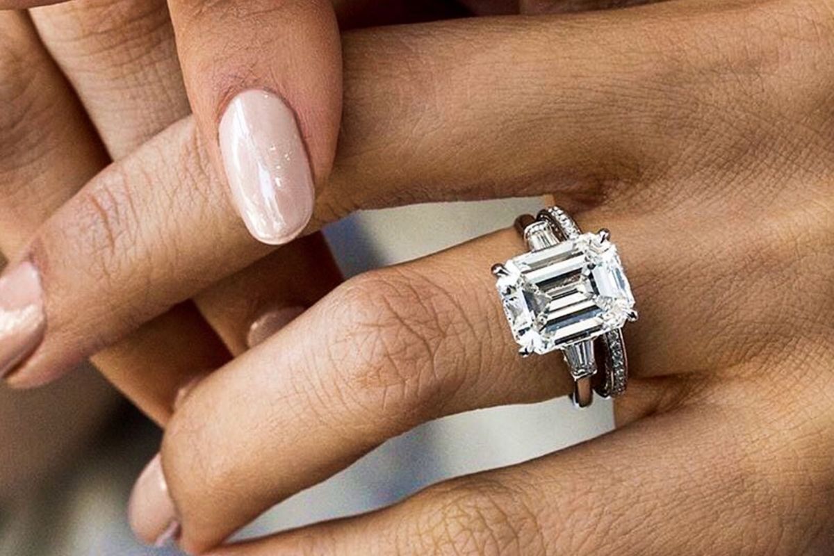 A lady wearing a beautiful Radiant Cut Diamond Ring