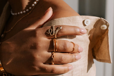 A lady wearing a lot of jewelry