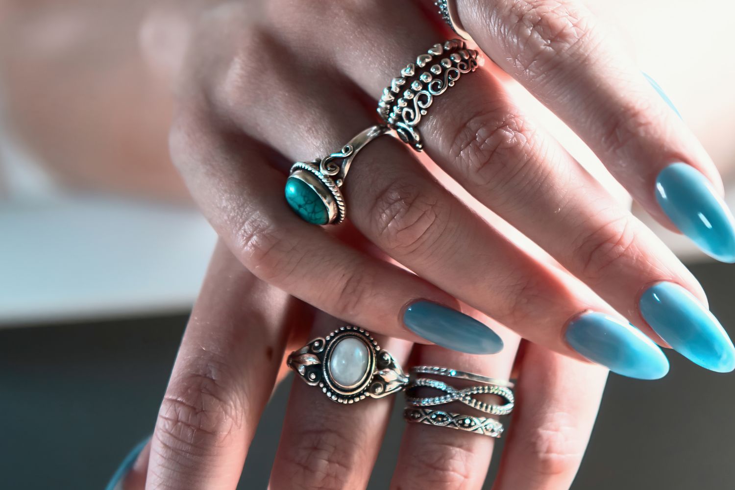 A lady wearing promise rings in both hands