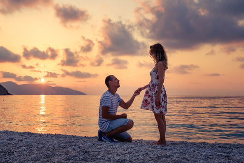 A man proposing to his girlfriend on a special occasion