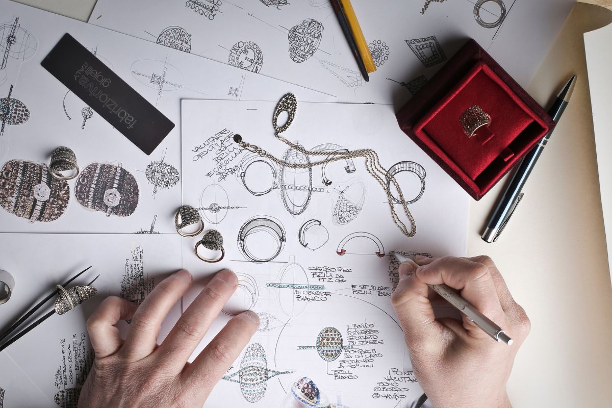 A ring designer designing a historically inspired ring for the customer