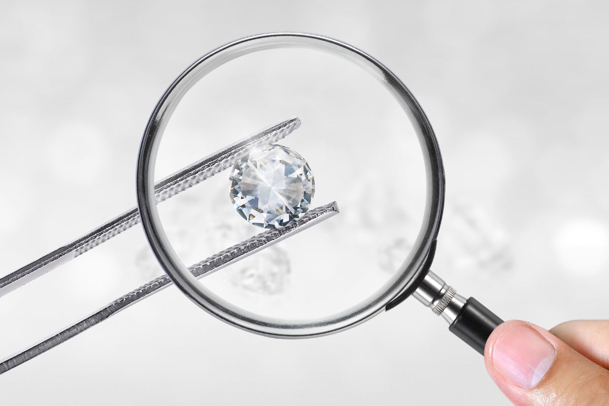 A rose cut diamond being evaluated by an expert