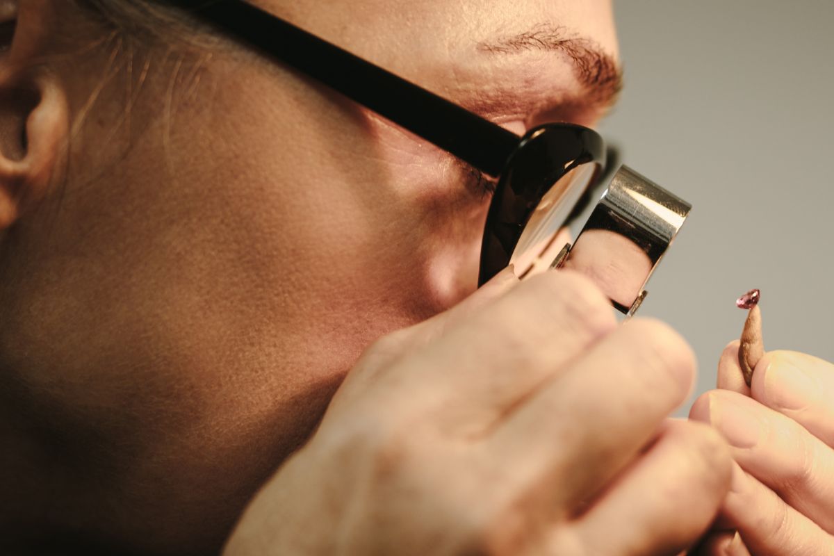 A woman checking the quality of a diamond