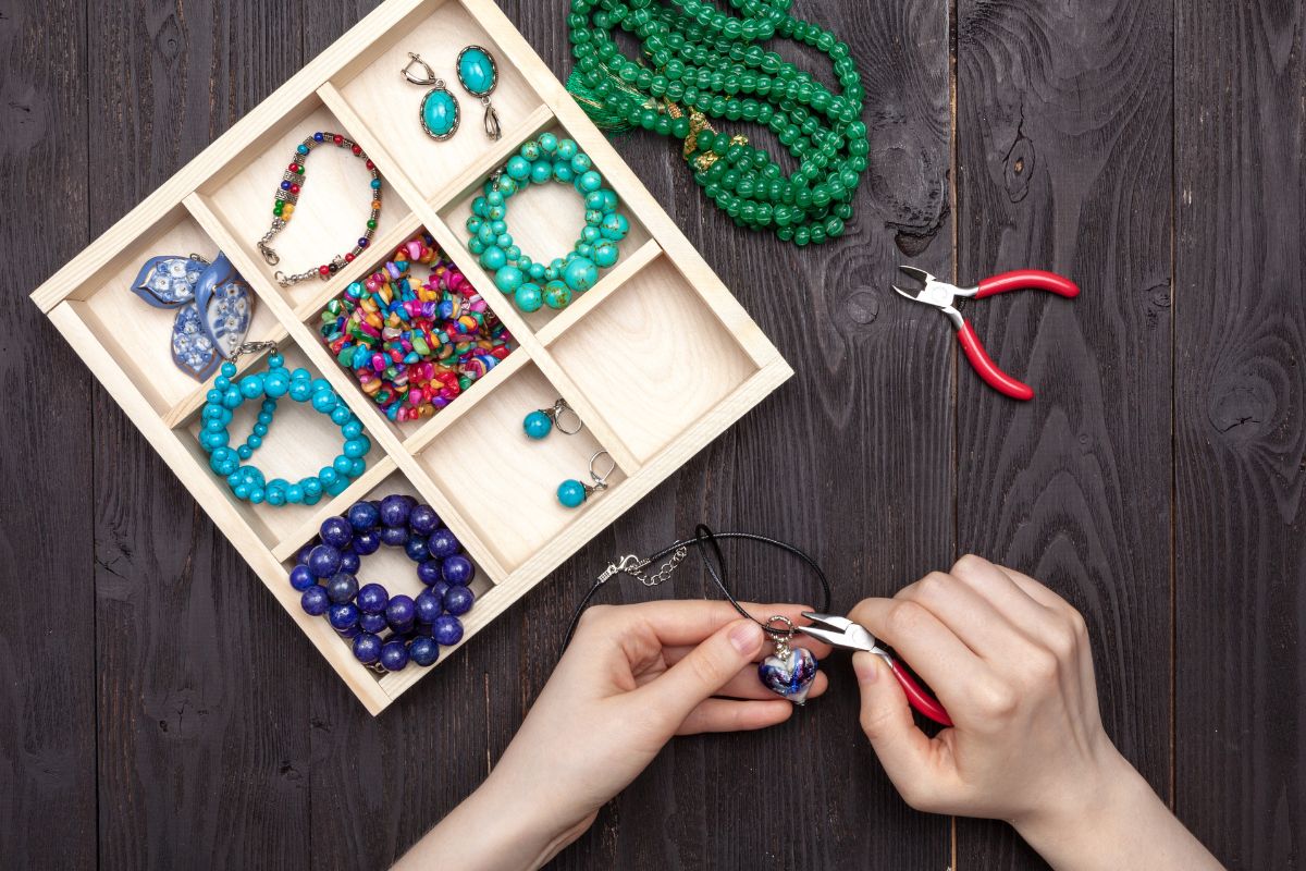A woman is engaged in crafting costume jewelry