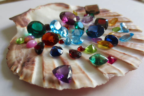 Different types of gemstones kept on a shell