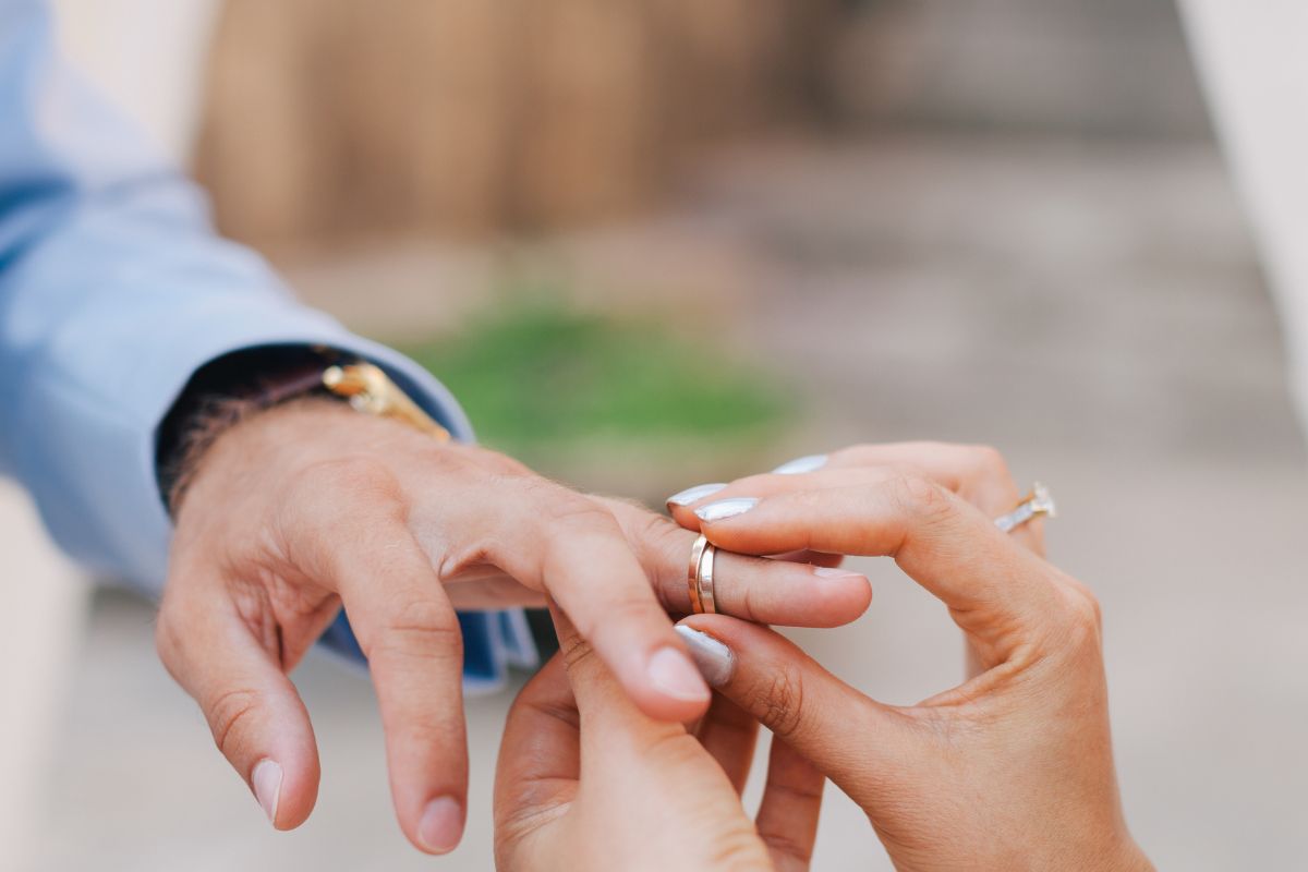 Bride and groom wearing wedding rings