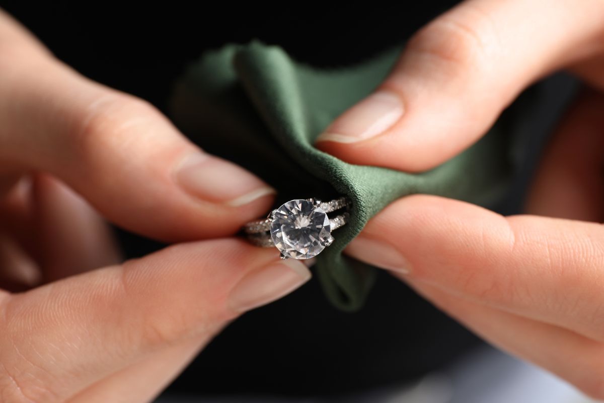 Cleaning a diamond ring with a soft cloth