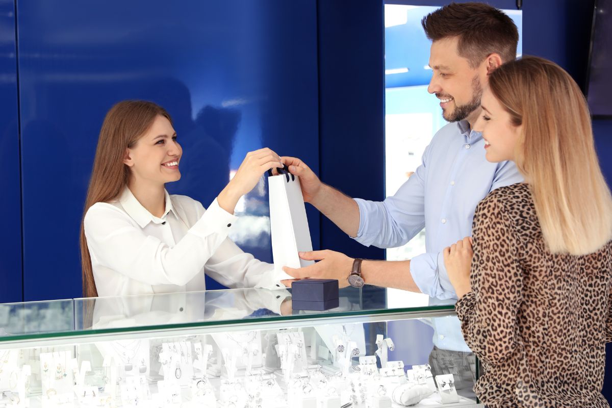 Couple buying diamond ring from store for more buying experience.