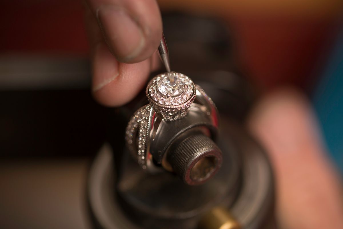 Diamond expert crafting a diamond ring for his client.