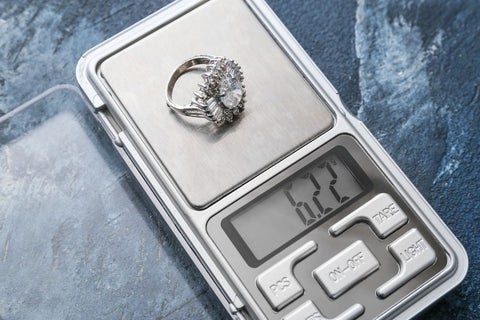 Diamond ring on a weighing scale