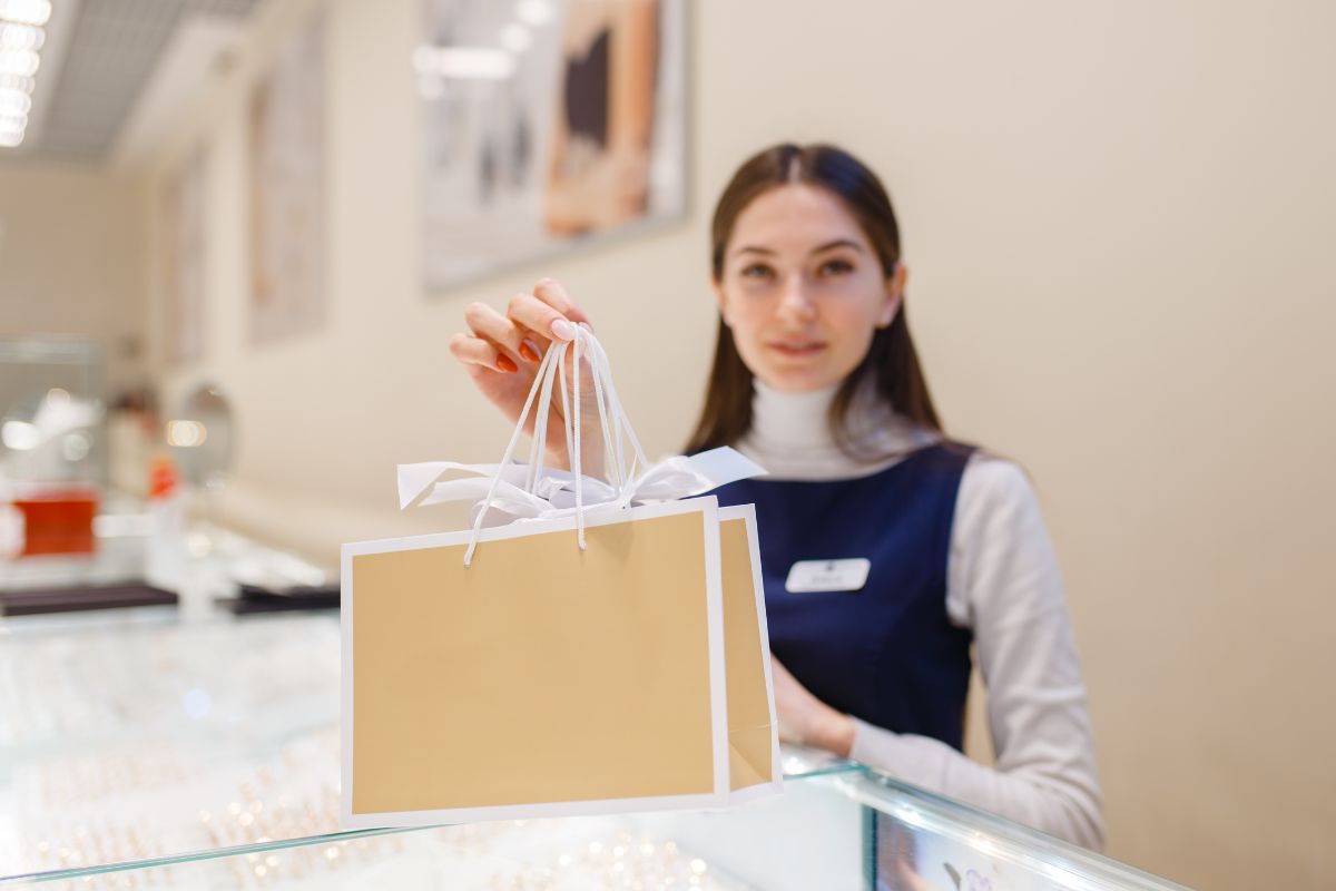 Diamond shop sales woman holding a package