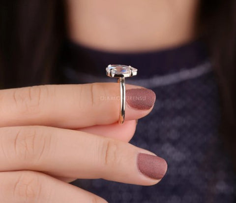 A lady holding a diamond ring