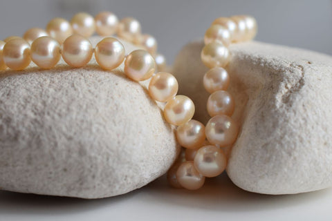Pearl necklace on a rock