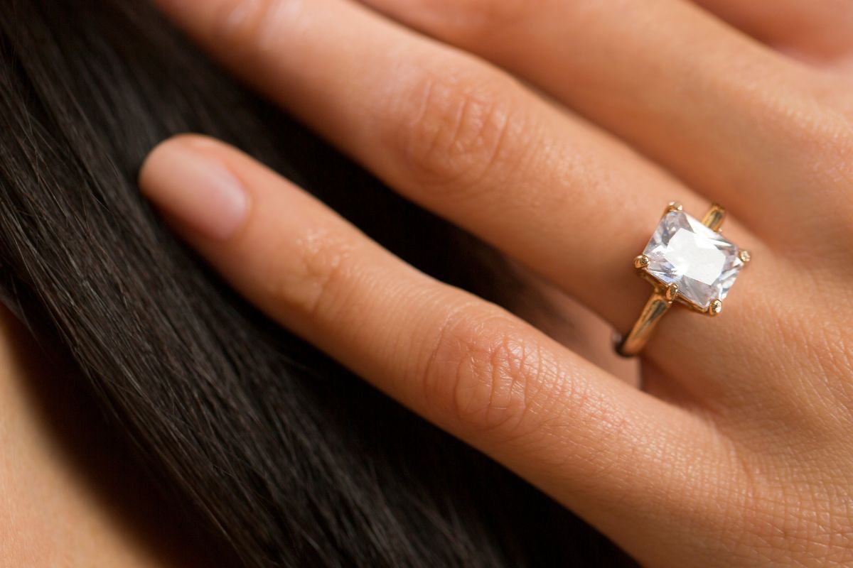 Shining diamond ring on a womans finger