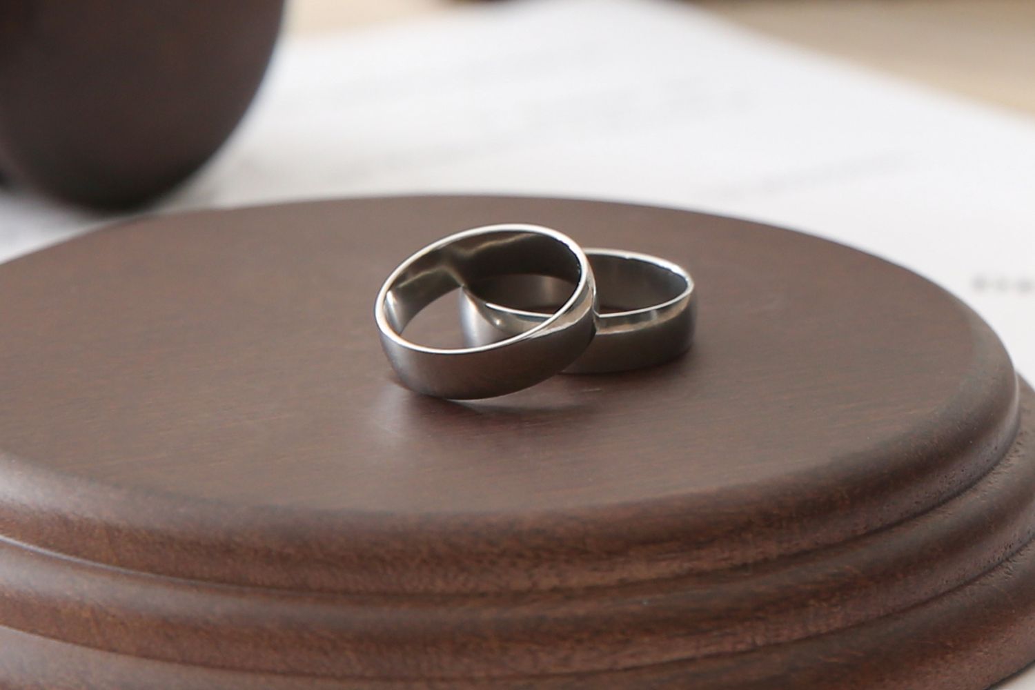 Two Tungsten Rings on a wooden table