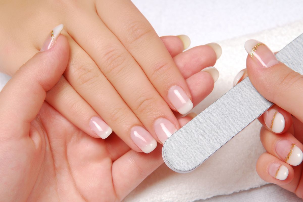 Woman shaping her nails for engagement