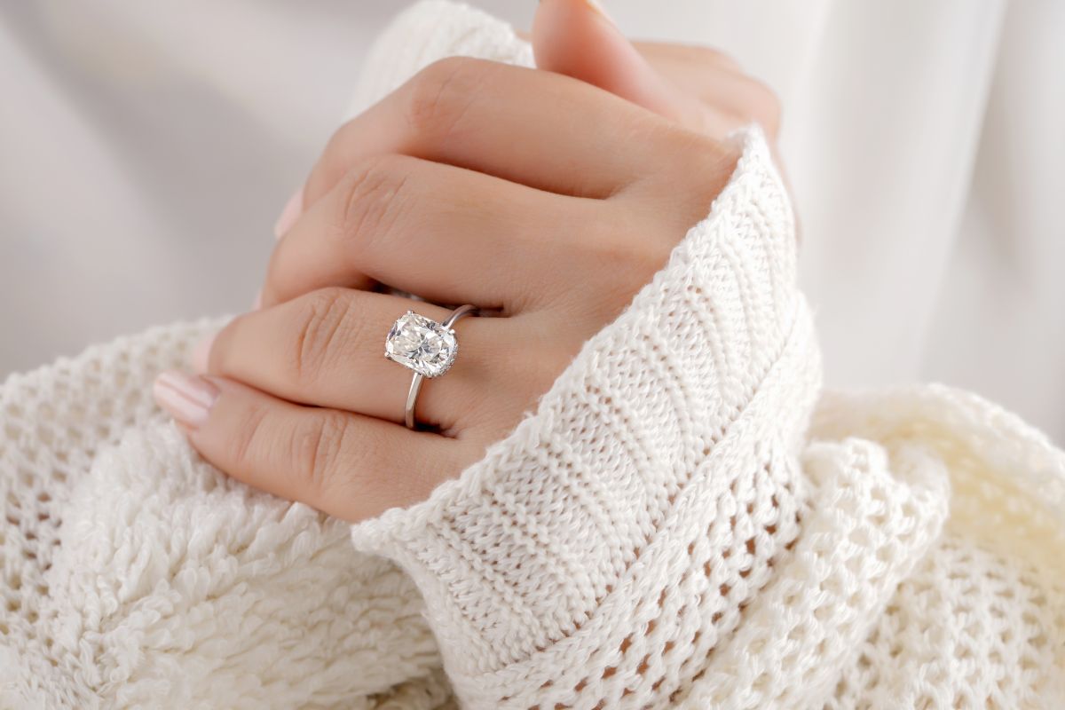 Woman wearing diamond ring on ring finger