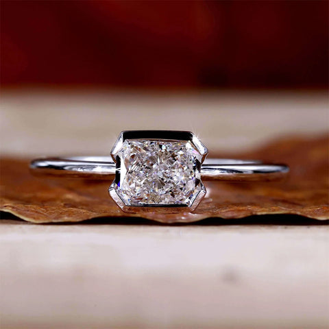 partial bezel set diamond ring