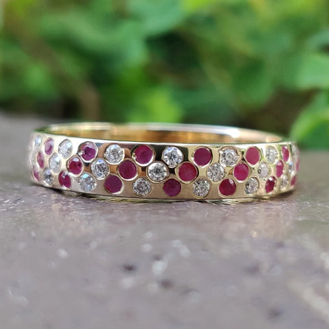 0.55 TCW Round Cut Ruby and Moissanite Eternity Wedding Band