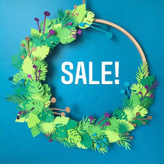 Wreath of paper leaves with Sale written inside