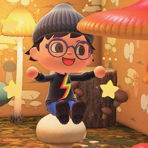 Photo taken from in game. Animal Crossing character is sat on a mushroom stool amongst a mushroom themed house wearing the Lightning Rainbow Jumper they designed in game.