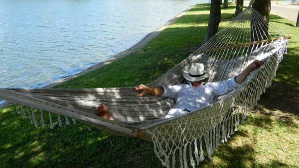 Man sleeping in a hammock with spreader bars