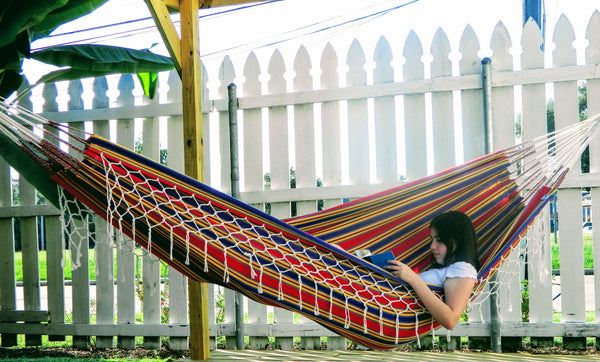 Girl laying in a classic hammock