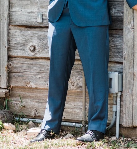 Modern fit pants in blue, showing a looser leg than the slim fit mens suit