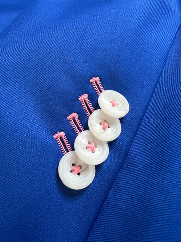 French blue suit with four white buttons - pink contrasting stitch