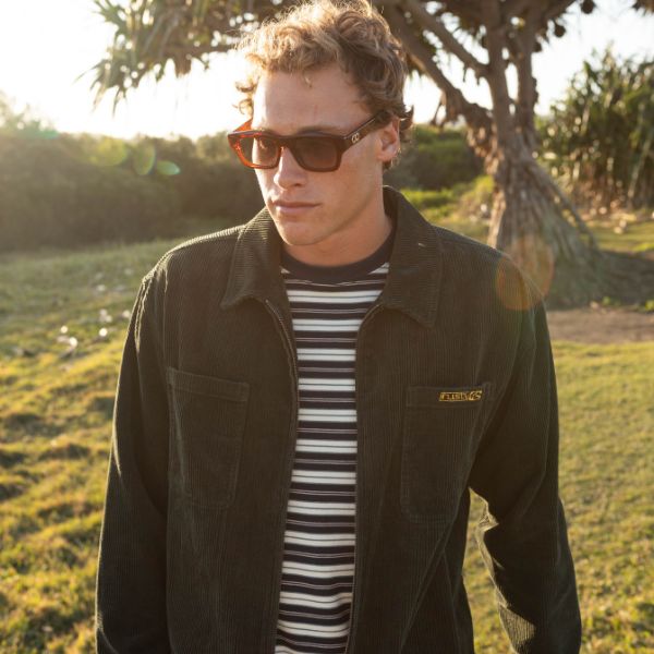 Man wearing Rusty corduroy jacket with stripe tee | Shop Mens Corduroy