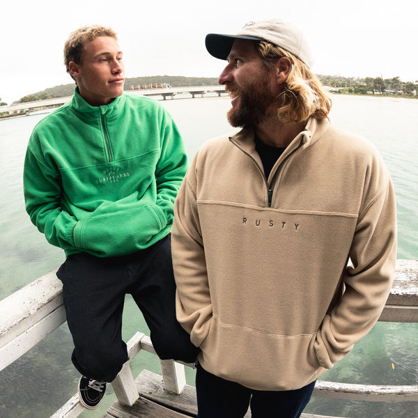 Team riders Letty Mortensen and Wade Carmichael wearing Rusty fleece. Pictured is the Middle Section Crew Polar Fleece in Amazon green and Polarized ¼ Zip Polar Fleece in colour Cuban sand.