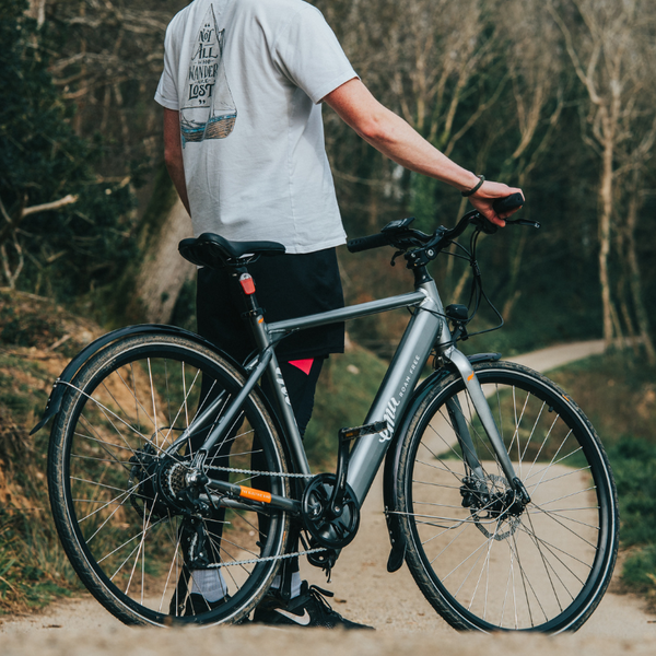 Man standing with Emu Crossbar electric bike