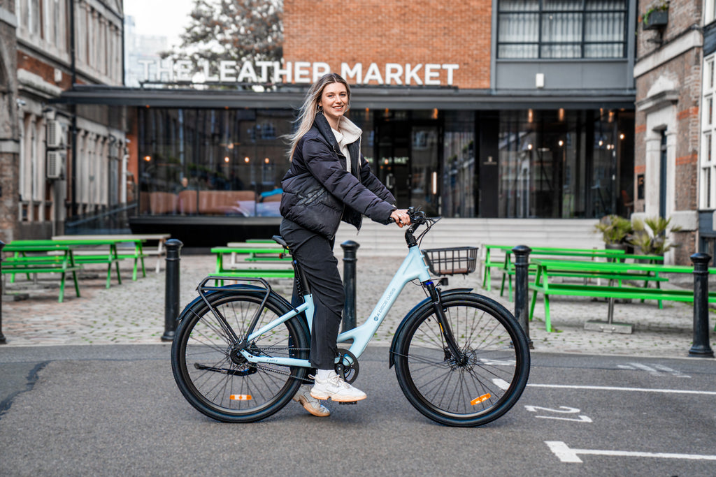 Women sitting on the ADO Air 28 electric bike