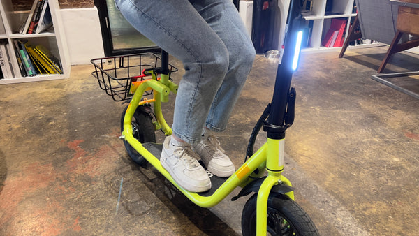 Reviewer riding Windgoo B9 electric scooter