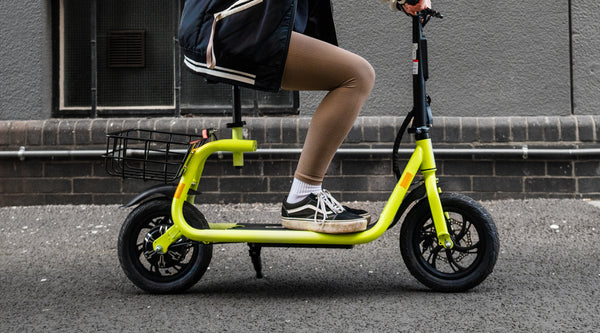 Reviewer riding Windgoo B9 electric scooter