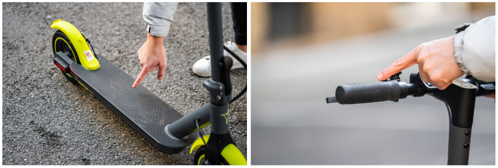 Person pointing at the handlebars and deck of an electric scooter